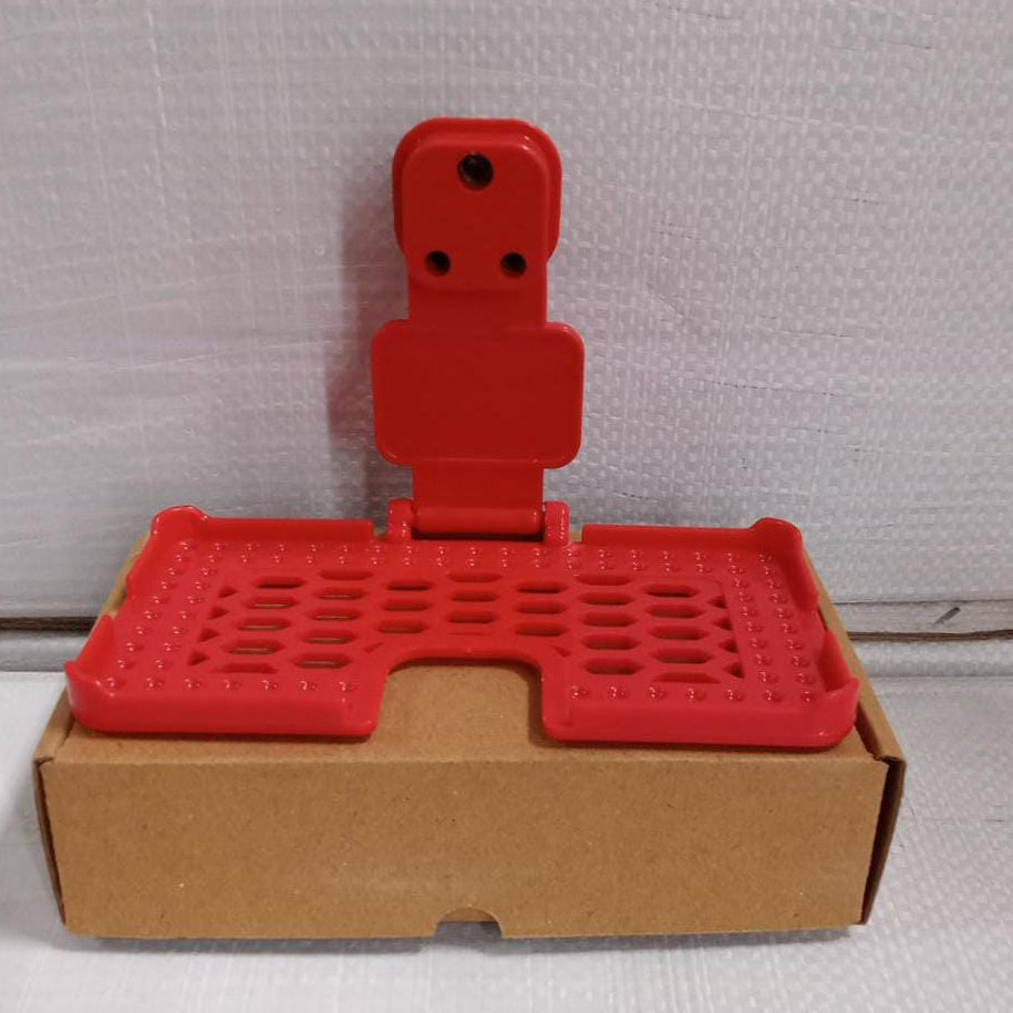 Multi-purpose wall holder in red.